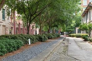 170 Boulevard Southeast, Unit E404 Atlanta, GA 30312 - Photo 29 of 42 a view of a backyard with potted plants and large trees