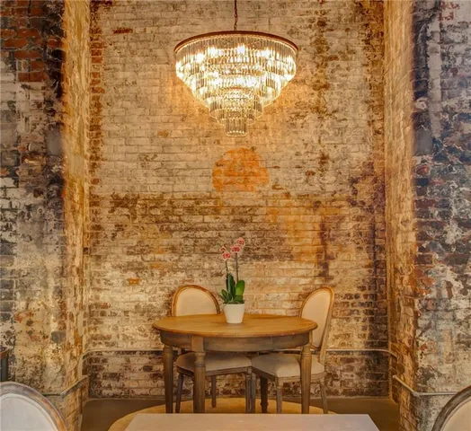 a kitchen with stainless steel appliances granite countertop a refrigerator and a stove