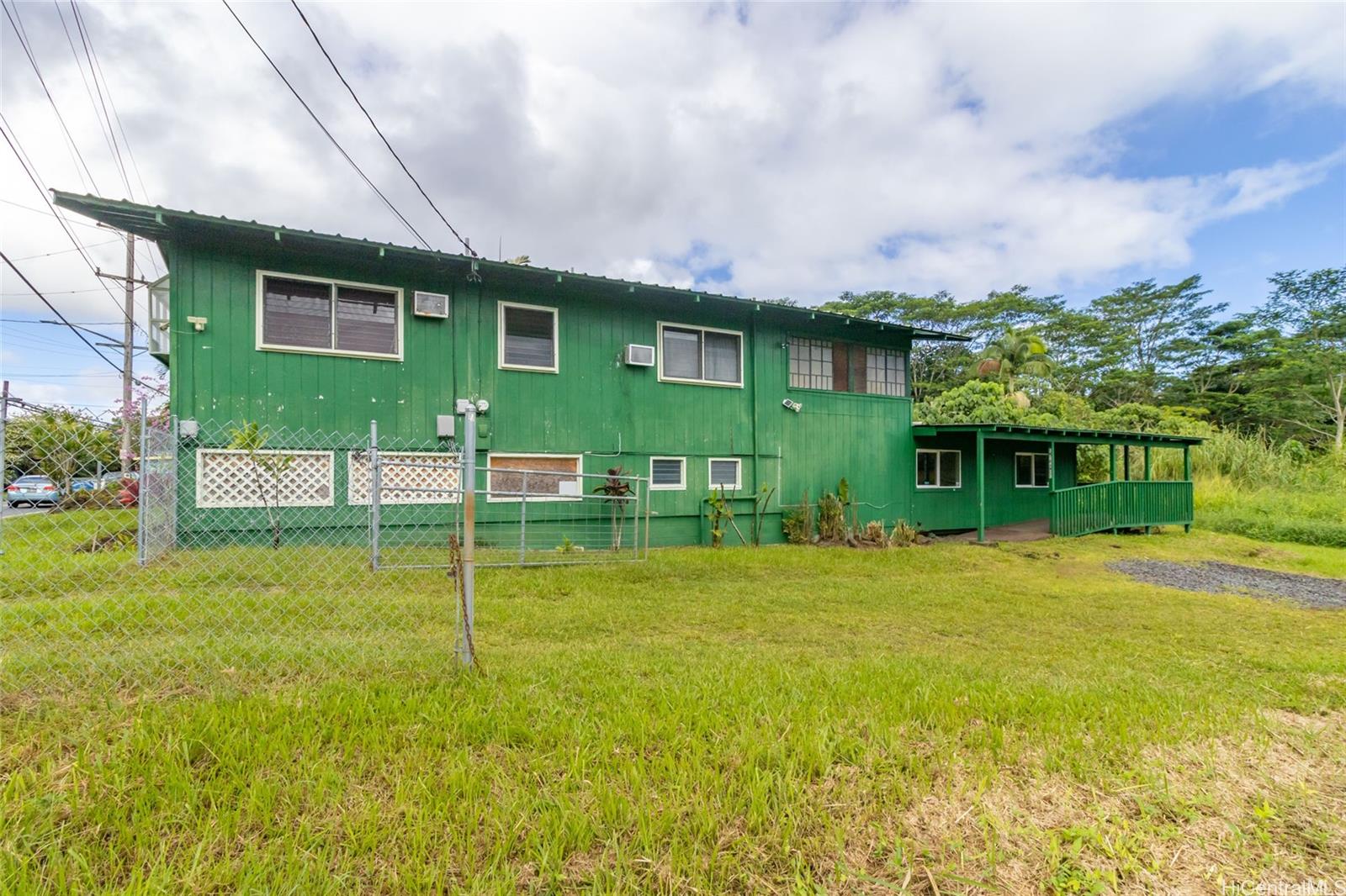 a view of a house next to a yard