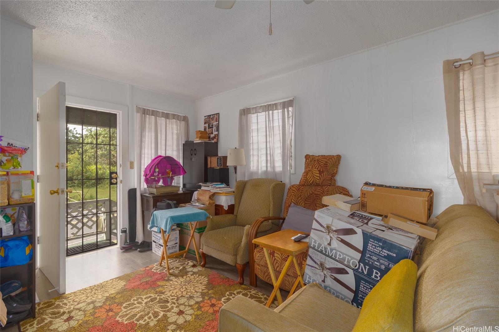 15-2885 Pahoa Village Road Pahoa, HI 96778 - Photo 11 of 25 a living room with furniture a rug and a window