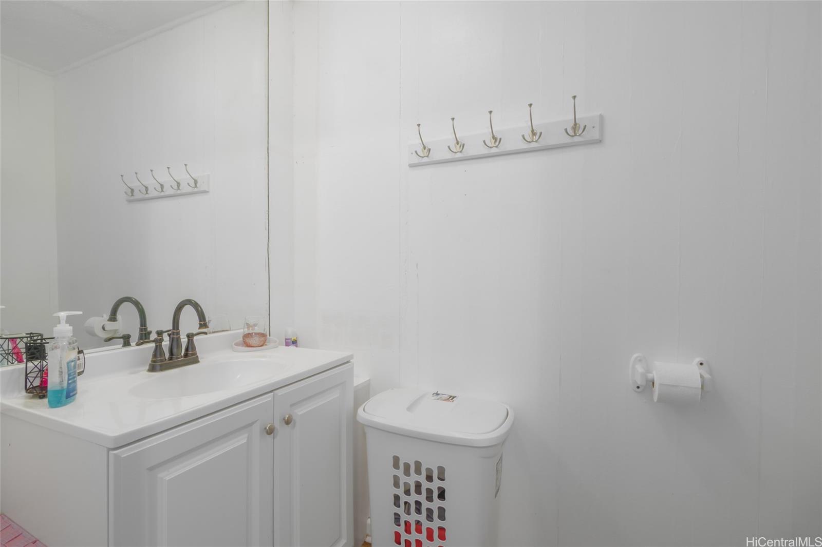 15-2885 Pahoa Village Road Pahoa, HI 96778 - Photo 7 of 25 a bathroom with a sink and a mirror