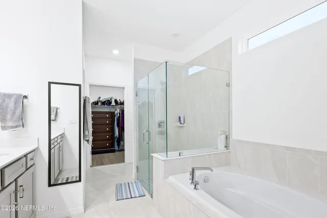 a bathroom with a bathtub and a shower