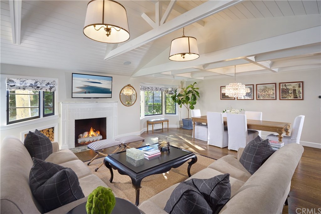 495 Arroyo Chico Laguna Beach, CA 92651 - Photo 5 of 28 a living room with furniture a fireplace and window