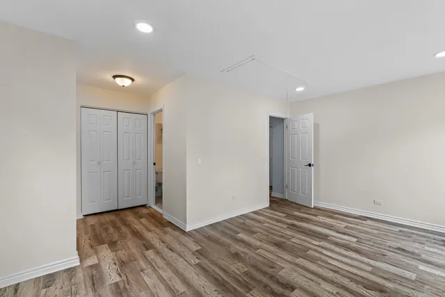 a view of hallway with wooden floor