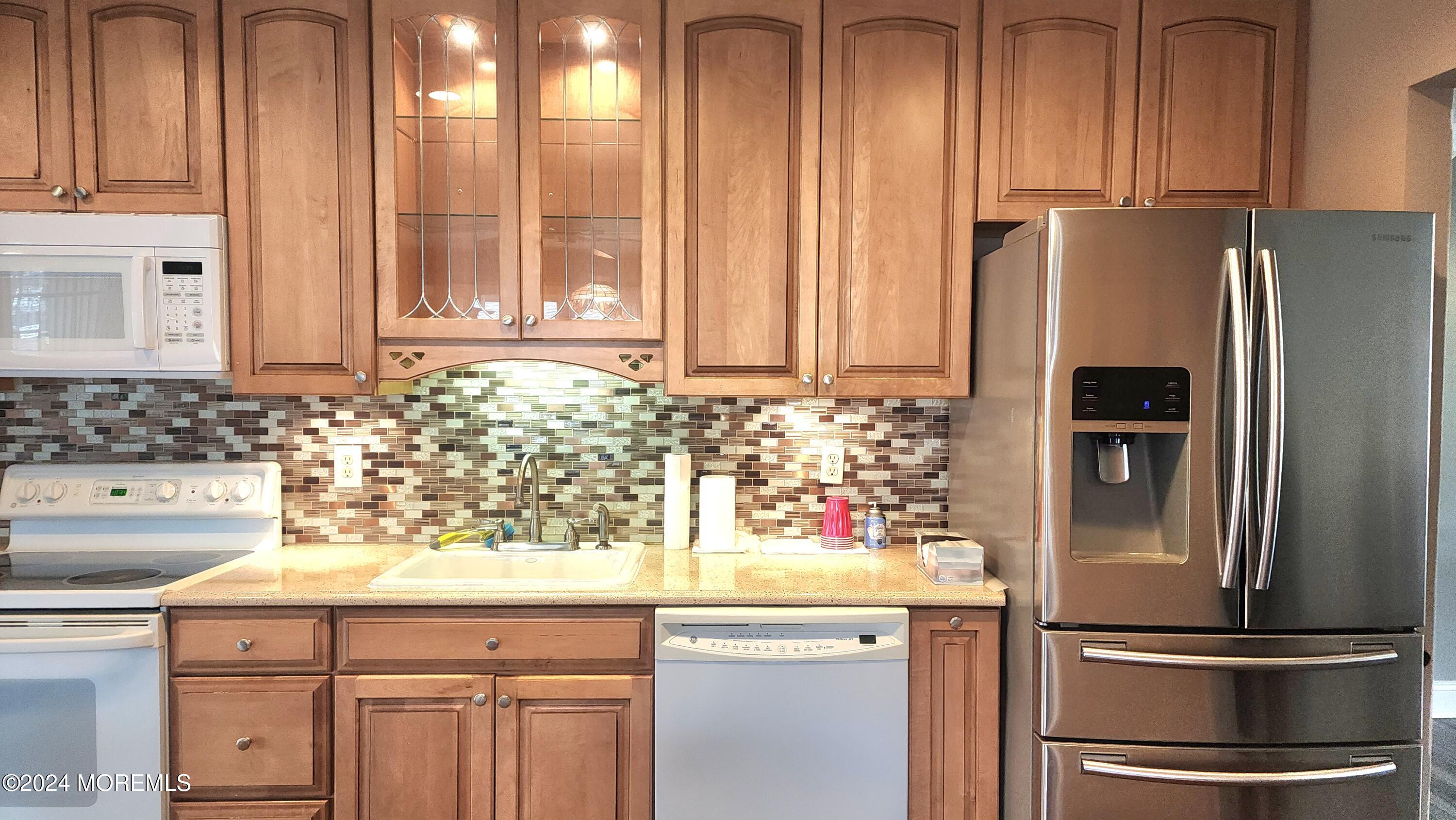 1 Ohio Drive, Unit B Whiting, NJ 08759 - Photo 15 of 37 a kitchen with stainless steel appliances granite countertop a refrigerator and a sink