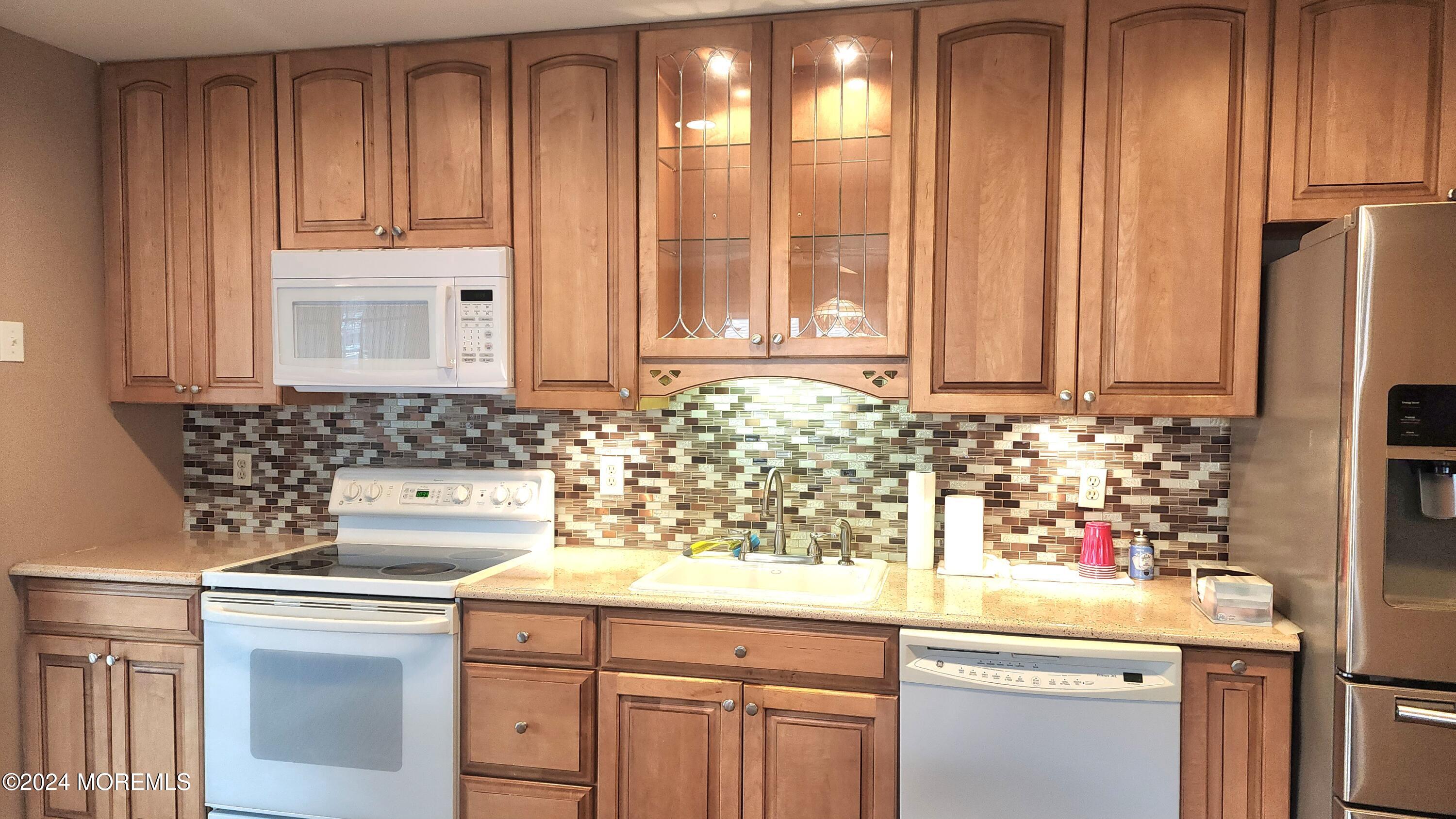 1 Ohio Drive, Unit B Whiting, NJ 08759 - Photo 16 of 37 a kitchen with stainless steel appliances granite countertop white cabinets and a sink
