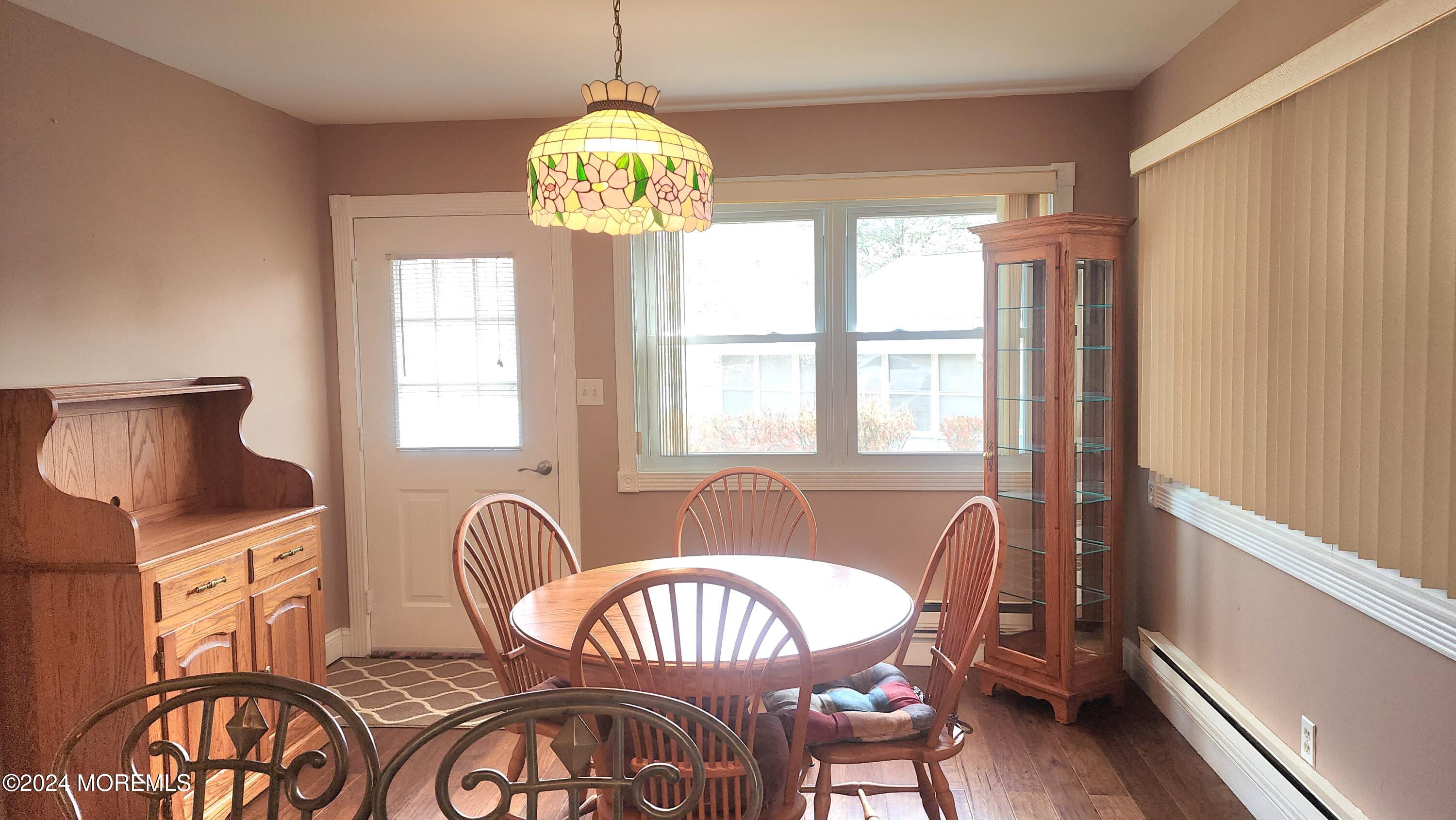 1 Ohio Drive, Unit B Whiting, NJ 08759 - Photo 21 of 37 a view of a dining room with furniture a chandelier and window