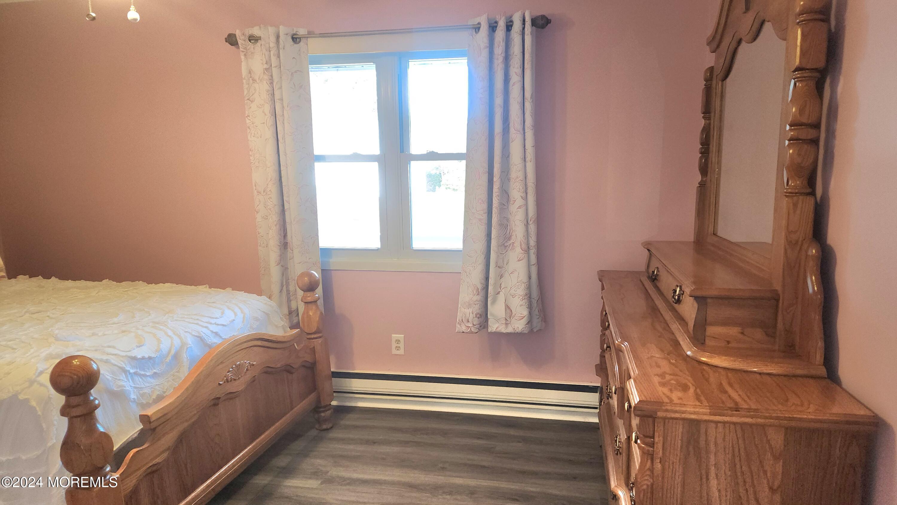 1 Ohio Drive, Unit B Whiting, NJ 08759 - Photo 24 of 37 a bed sitting in a bedroom next to a window