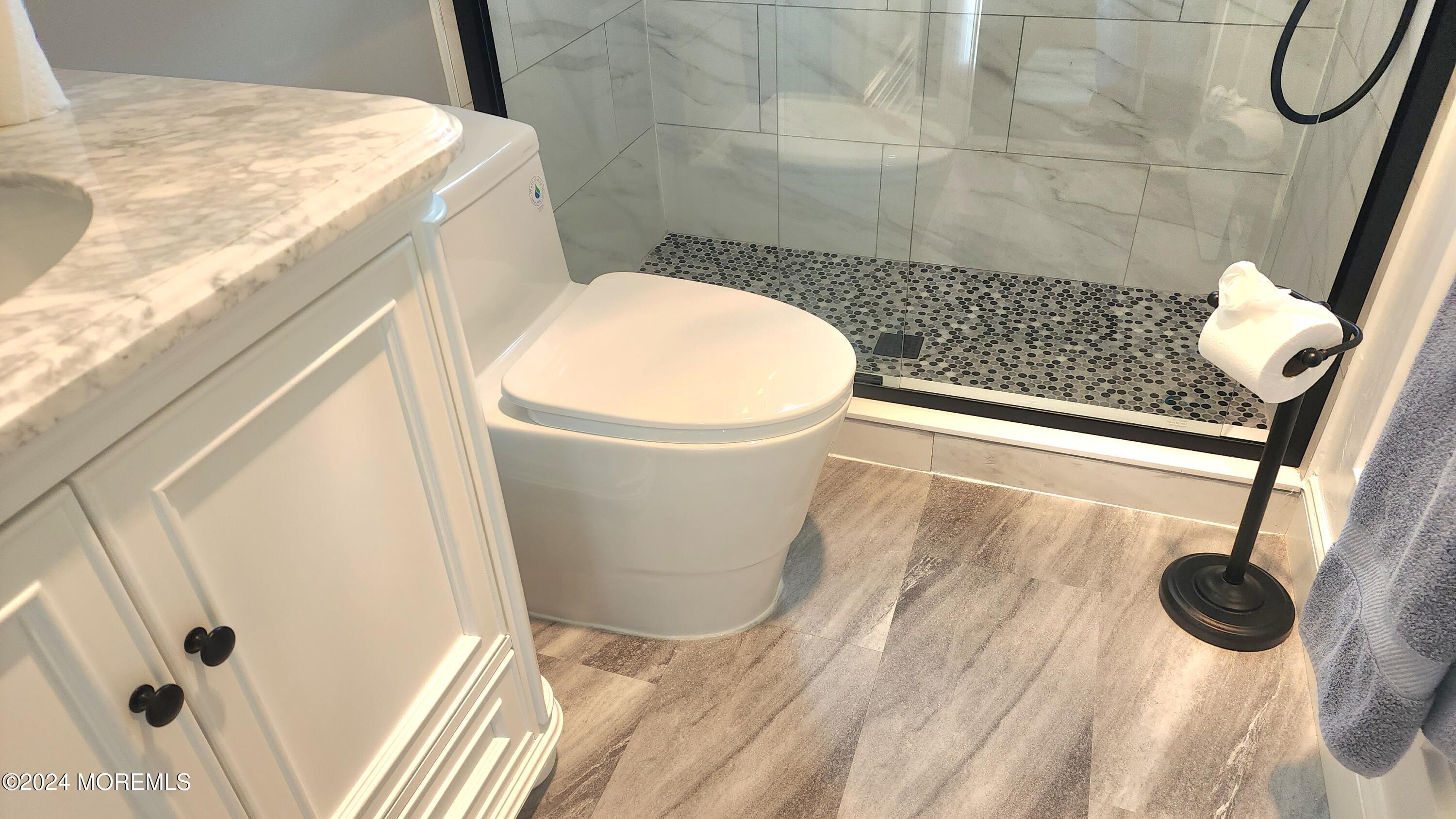 1 Ohio Drive, Unit B Whiting, NJ 08759 - Photo 27 of 37 a bathroom with a sink and a mirror