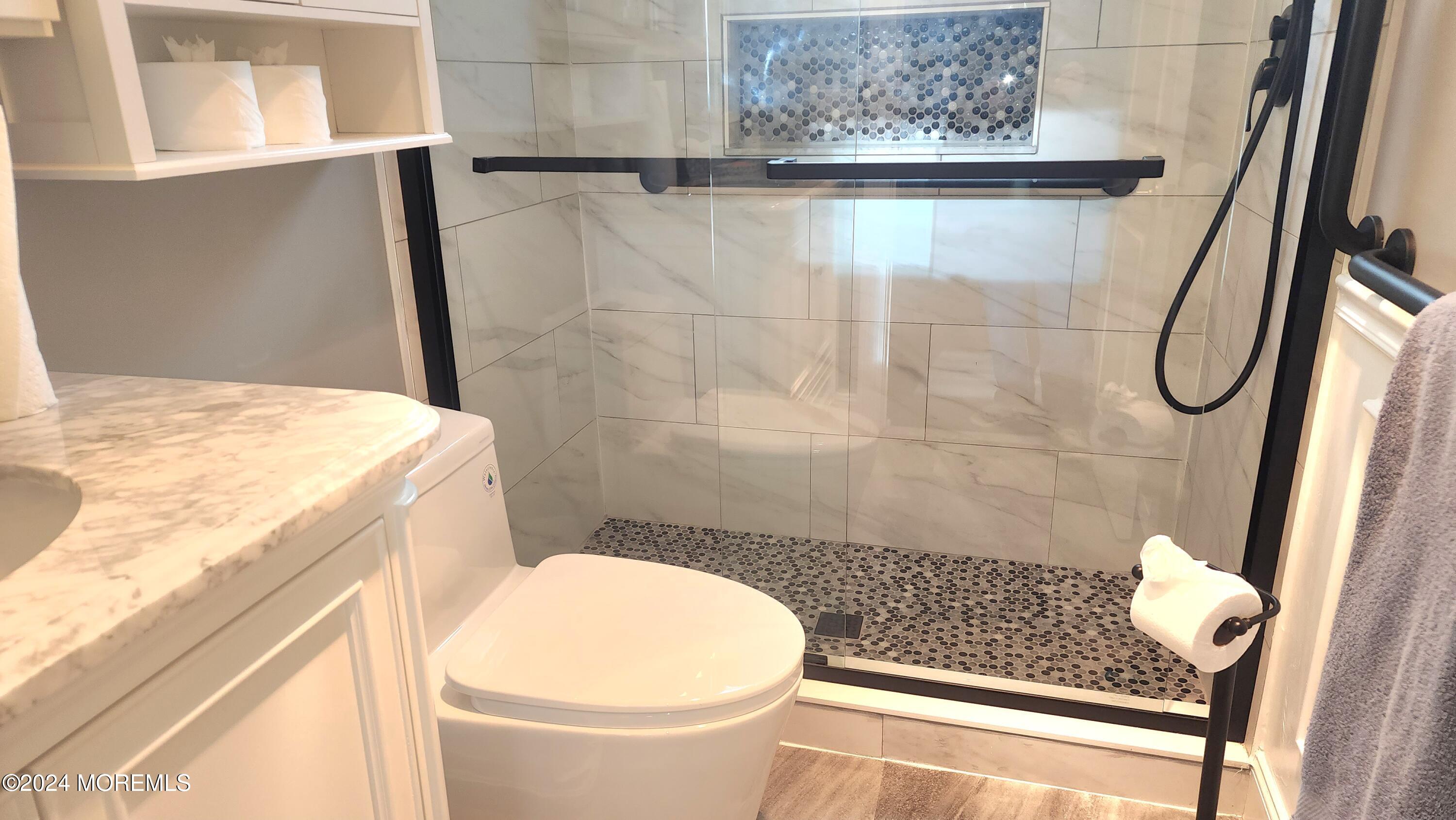 1 Ohio Drive, Unit B Whiting, NJ 08759 - Photo 28 of 37 a bathroom with a granite countertop sink toilet and shower