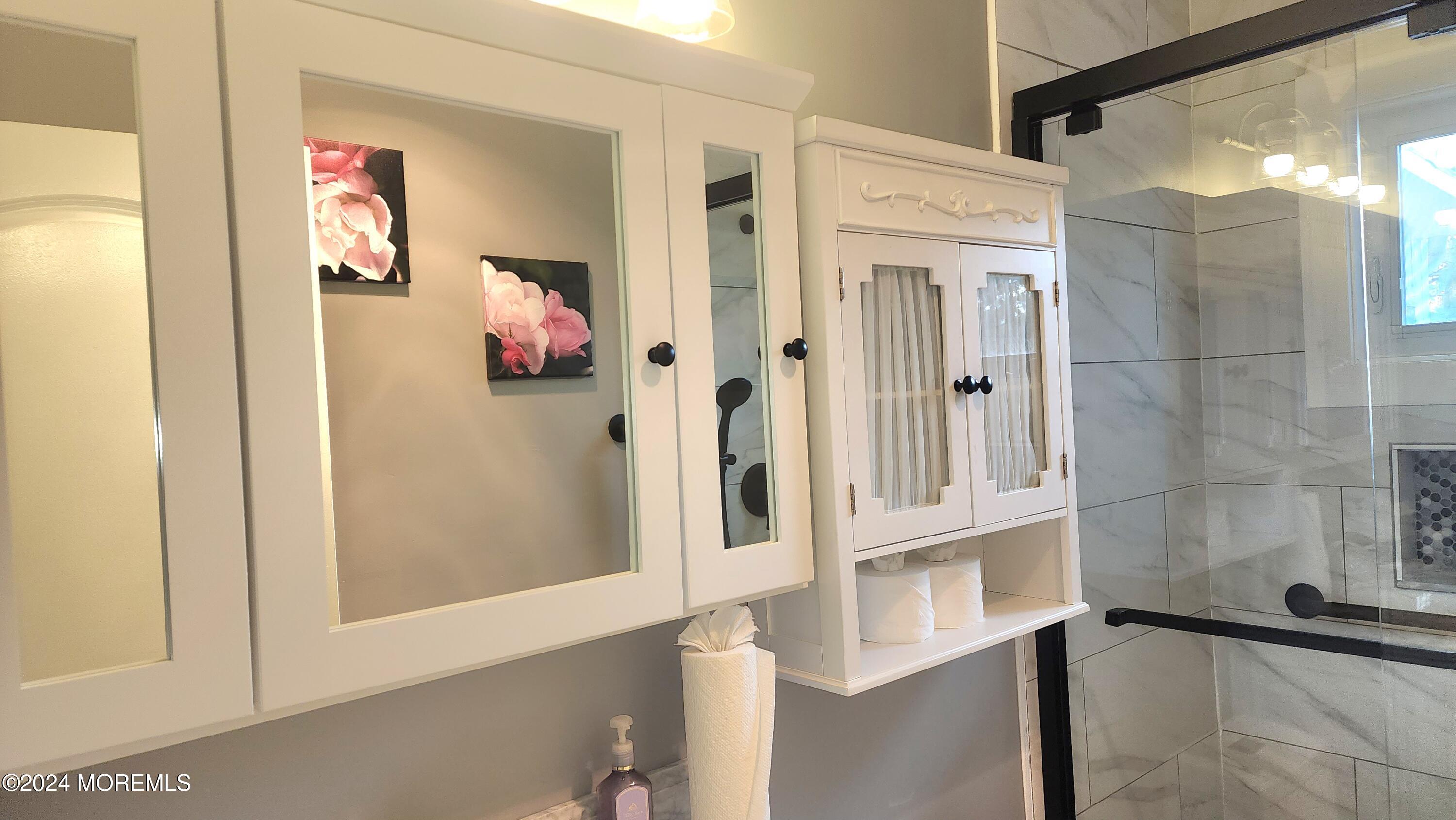 1 Ohio Drive, Unit B Whiting, NJ 08759 - Photo 30 of 37 view of a hallway with paintings on the wall