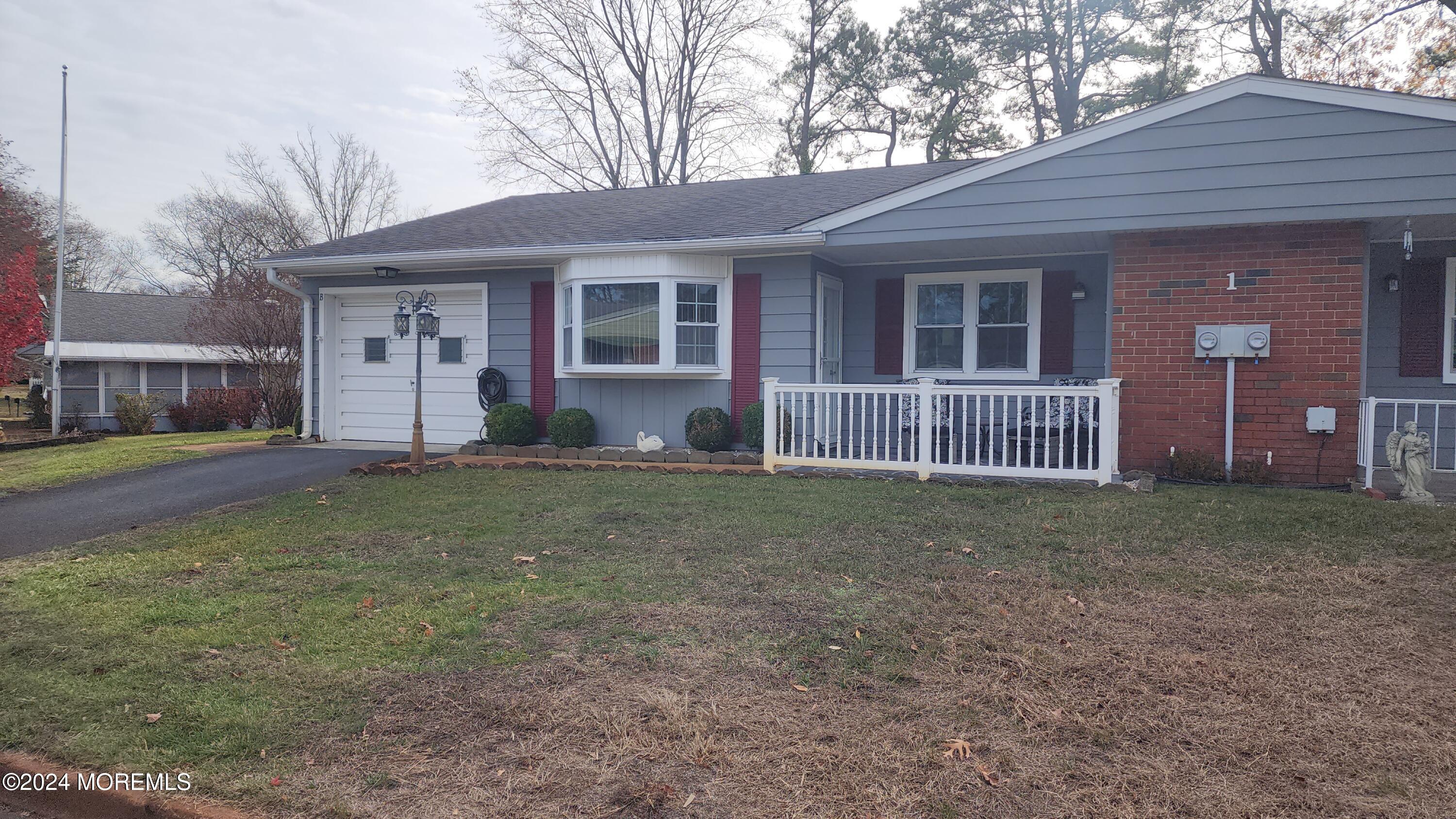 1 Ohio Drive, Unit B Whiting, NJ 08759 - Photo 3 of 37 a house view with a backyard space