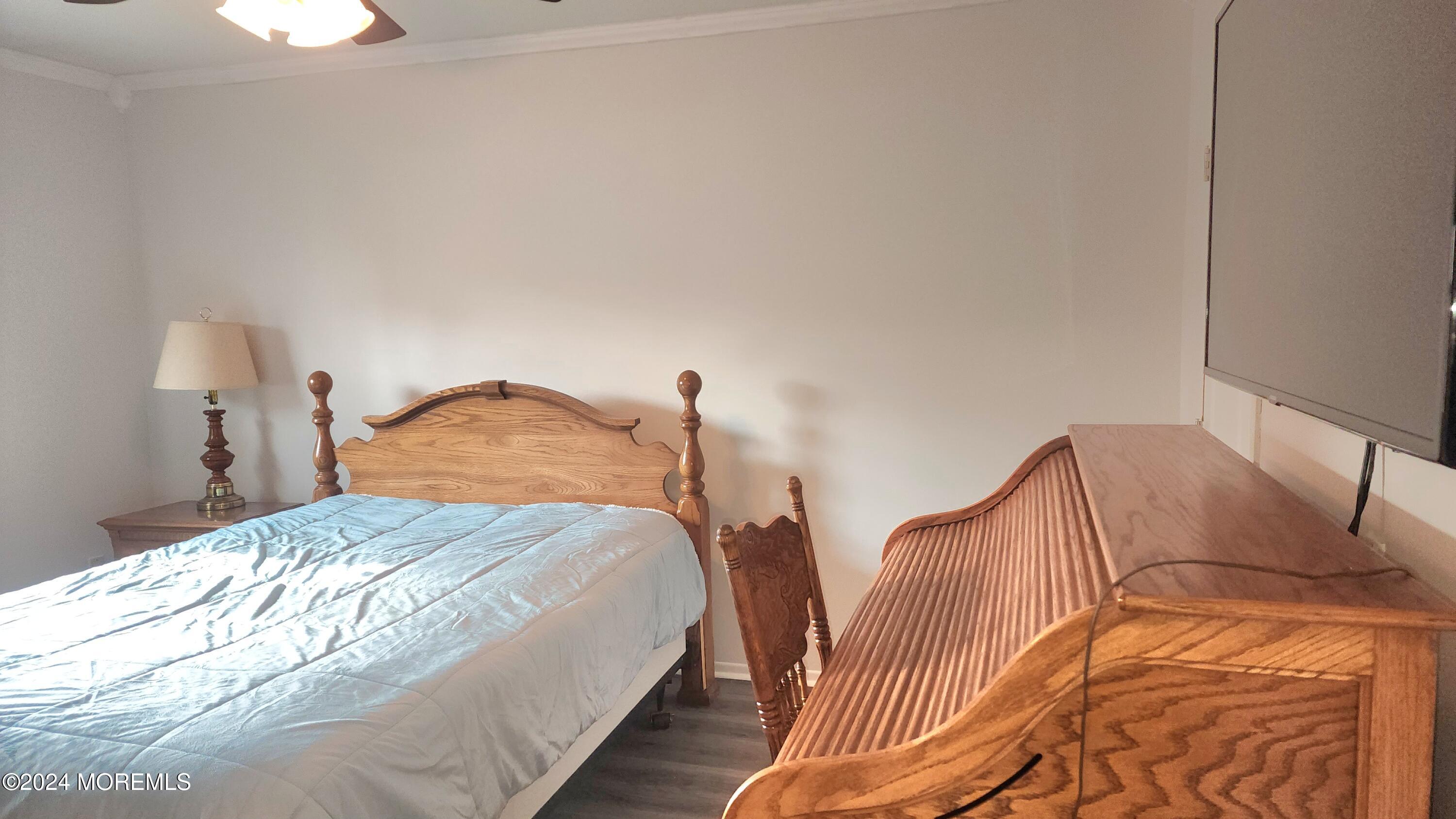 1 Ohio Drive, Unit B Whiting, NJ 08759 - Photo 32 of 37 a bedroom with bed and a night stand