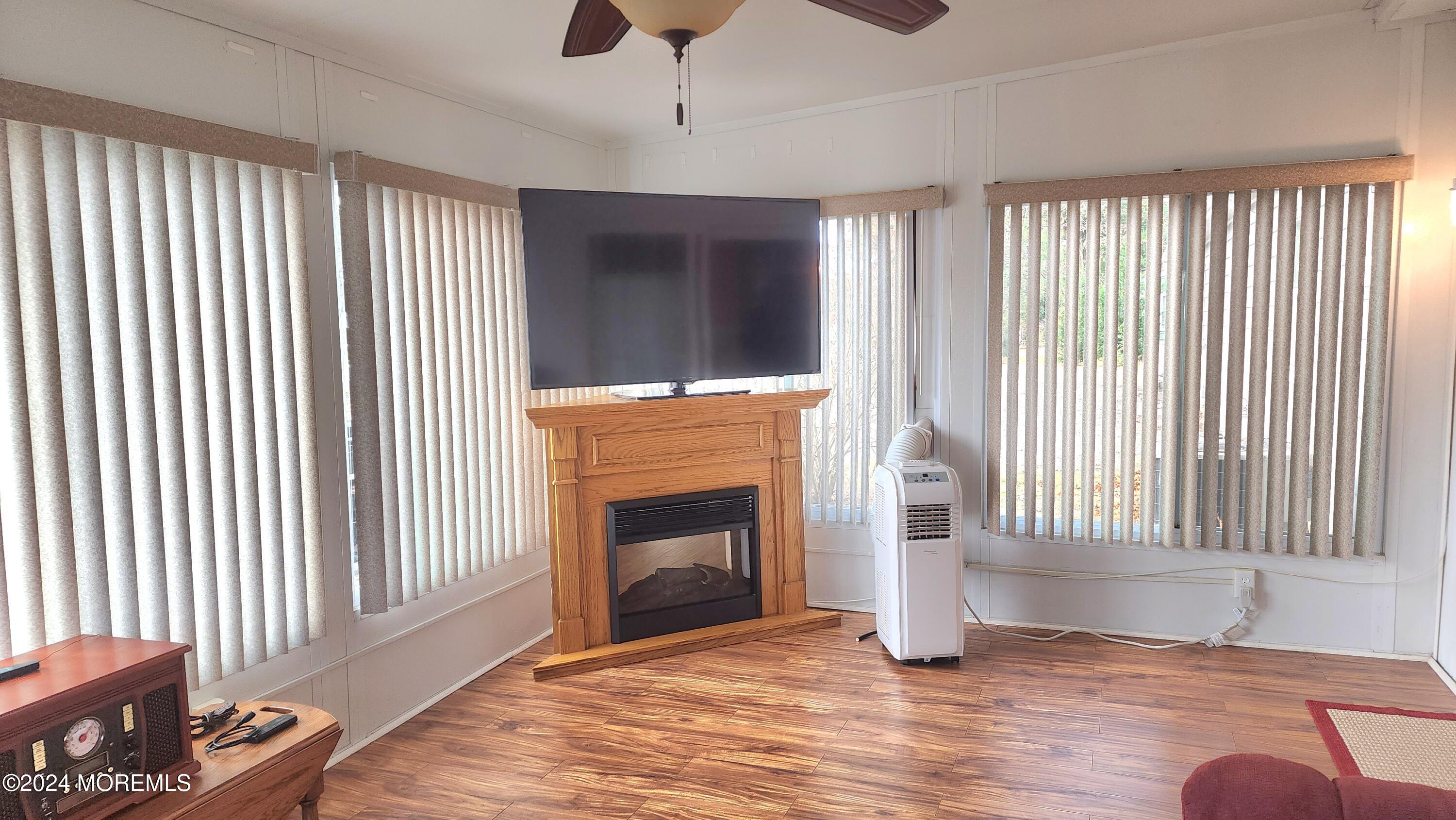 1 Ohio Drive, Unit B Whiting, NJ 08759 - Photo 36 of 37 a view of an empty room with wooden floor and a window