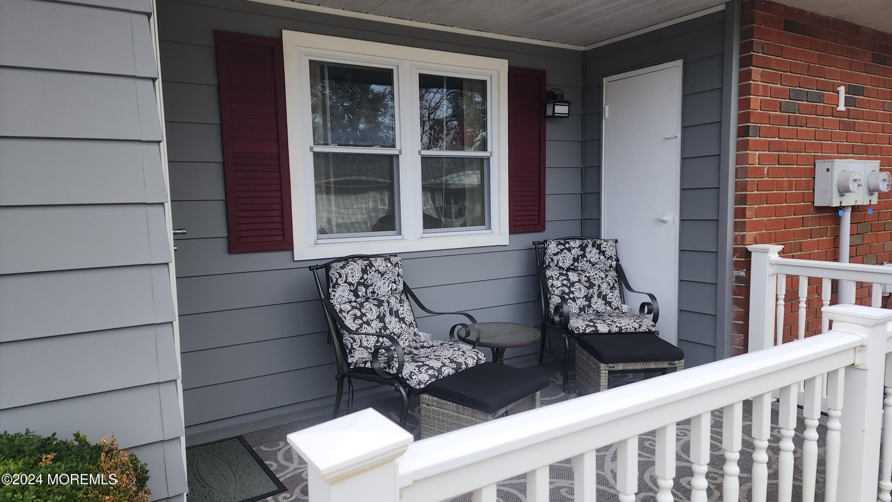1 Ohio Drive, Unit B Whiting, NJ 08759 - Photo 5 of 37 a wooden bench sitting in front of a building