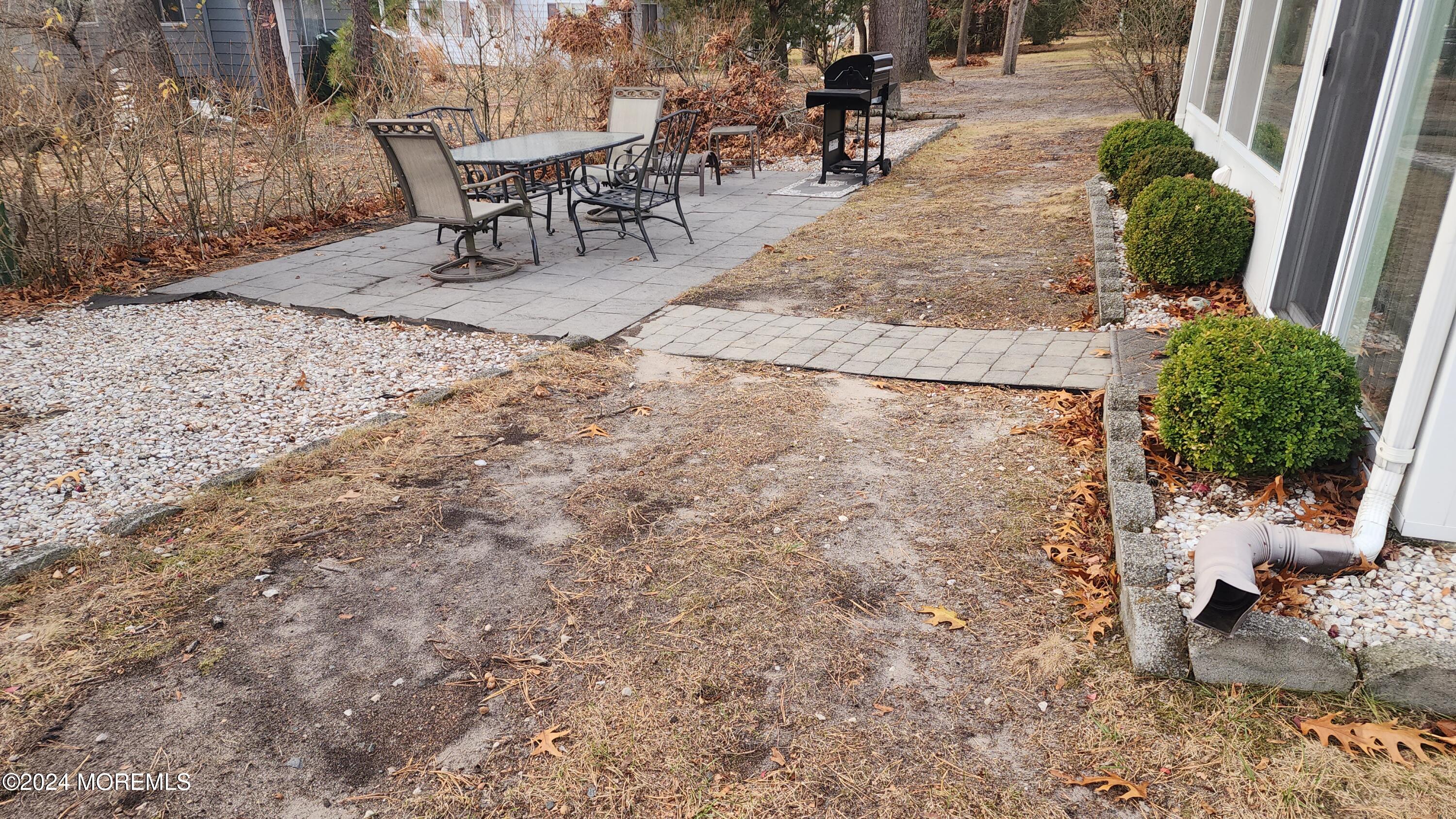 1 Ohio Drive, Unit B Whiting, NJ 08759 - Photo 7 of 37 a view of a backyard with sitting area