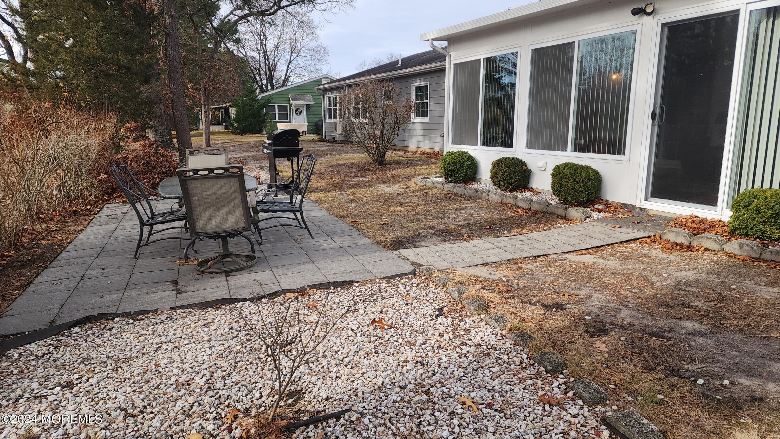 1 Ohio Drive, Unit B Whiting, NJ 08759 - Photo 8 of 37 a view of a house with backyard and sitting area