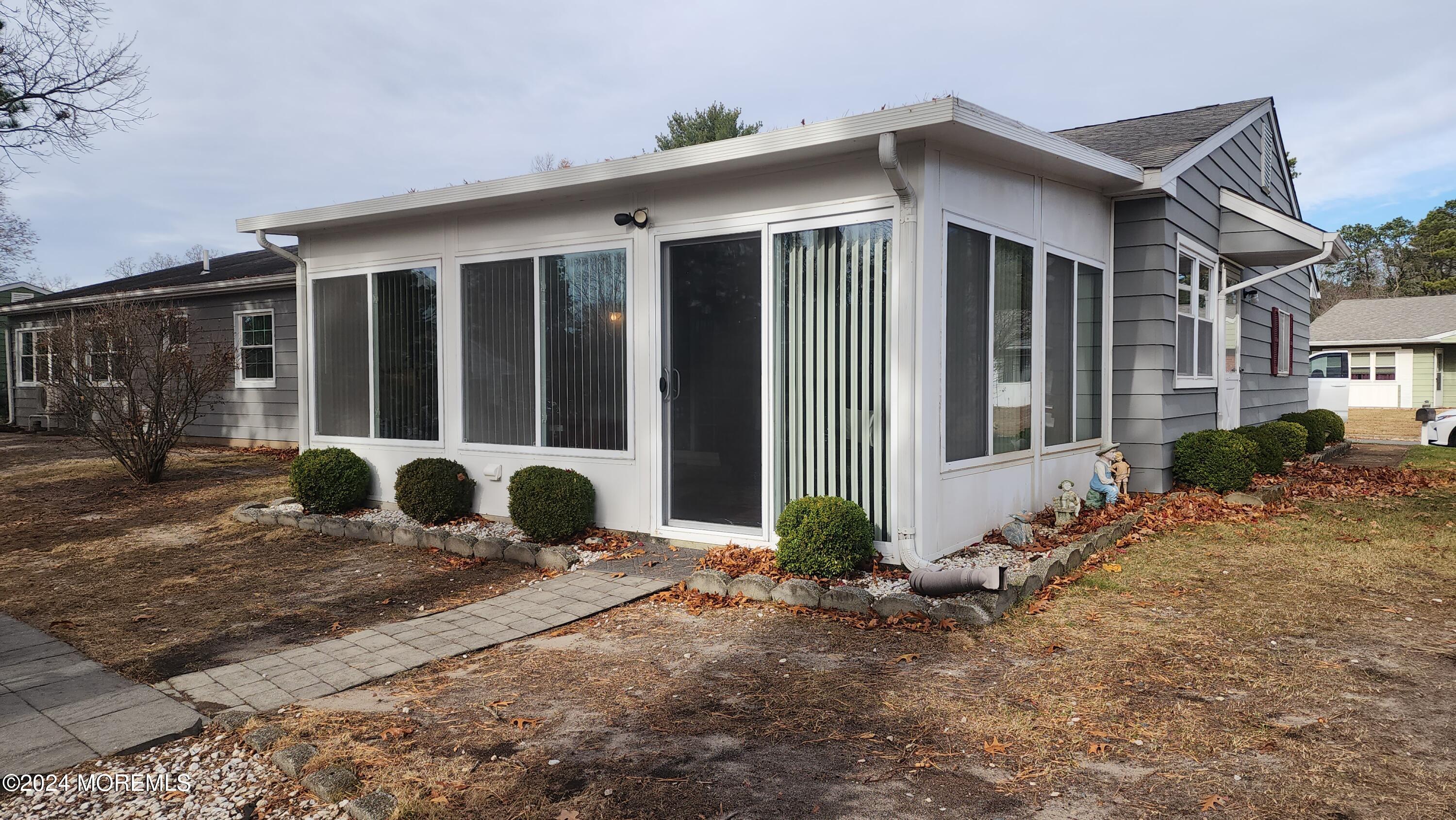 1 Ohio Drive, Unit B Whiting, NJ 08759 - Photo 9 of 37 a front view of a house with garden