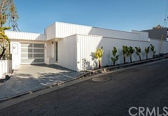 a front view of a house with garage
