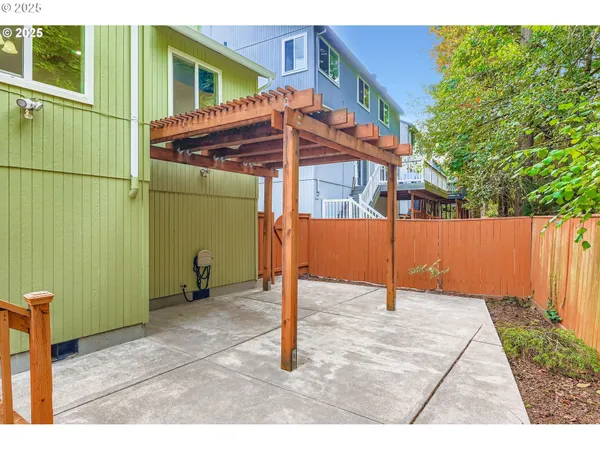 a backyard of a house with shaded area