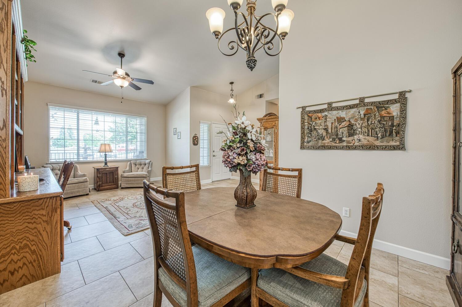 2512 Keats Avenue Clovis, CA 93611 - Photo 13 of 39 a view of a dining room with furniture window and wooden floor
