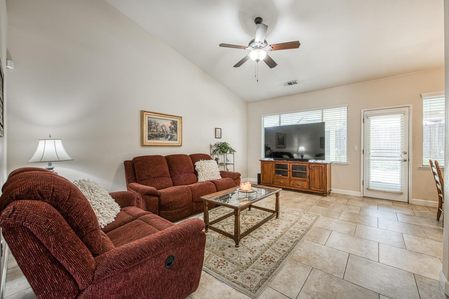 2512 Keats Avenue Clovis, CA 93611 - Photo 16 of 39 a living room with furniture and a flat screen tv