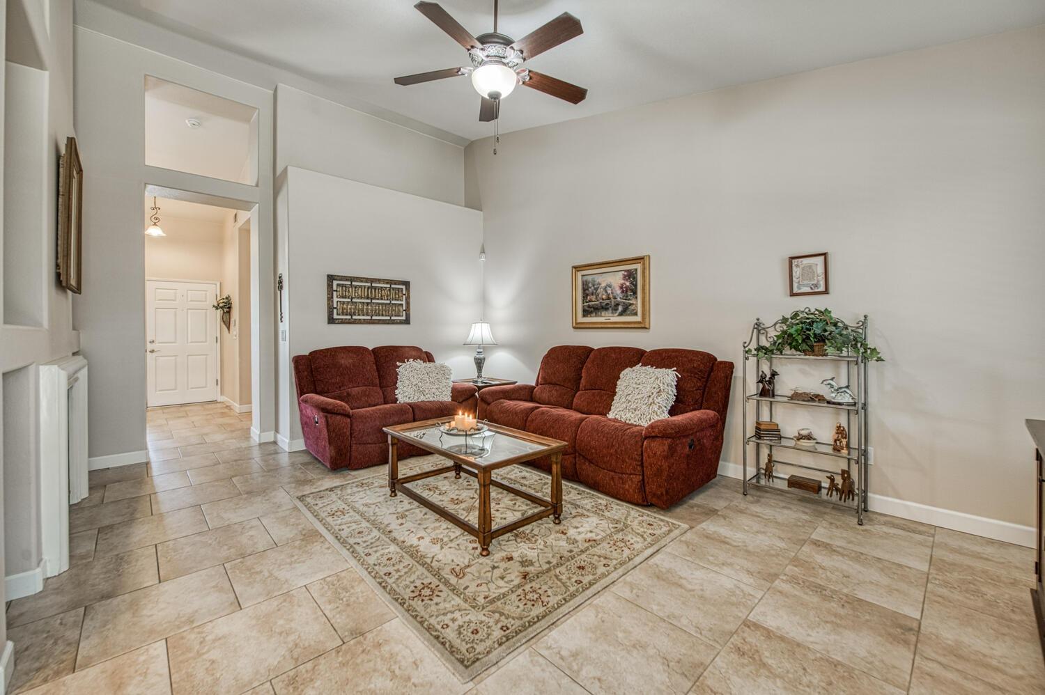 2512 Keats Avenue Clovis, CA 93611 - Photo 17 of 39 a living room with furniture and a chandelier
