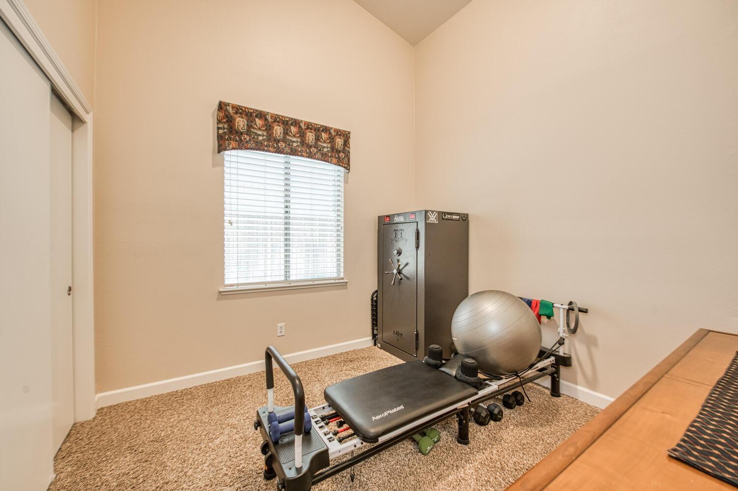 2512 Keats Avenue Clovis, CA 93611 - Photo 28 of 39 a view of a workspace with furniture and a window