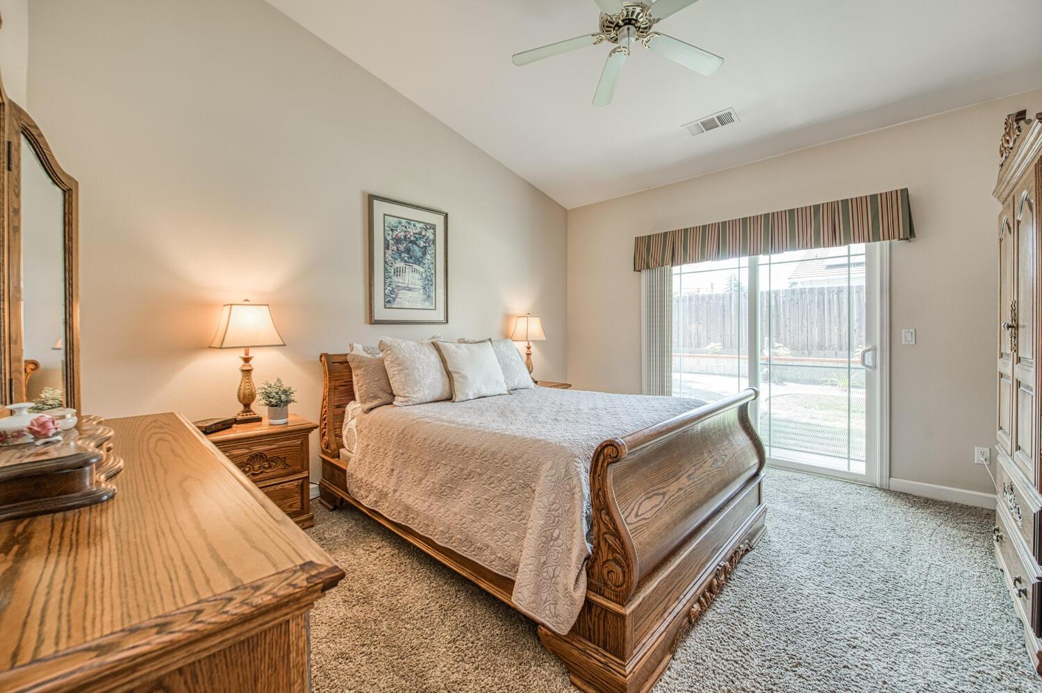 2512 Keats Avenue Clovis, CA 93611 - Photo 30 of 39 a bedroom with two beds and a chandelier