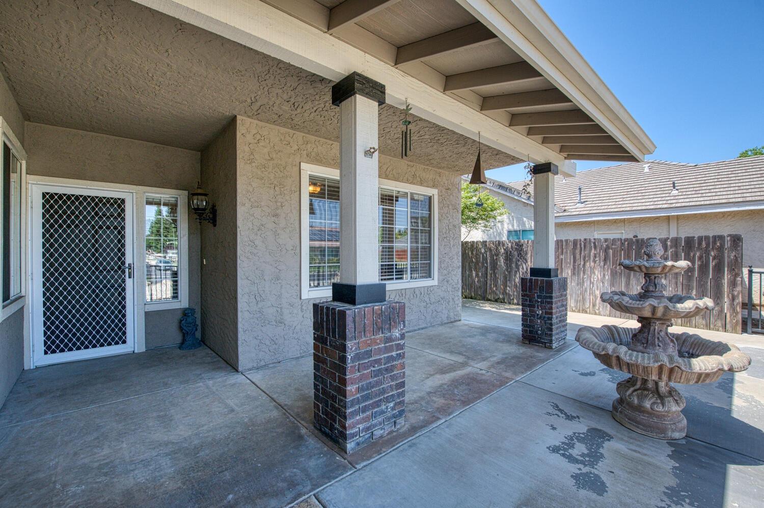 2512 Keats Avenue Clovis, CA 93611 - Photo 6 of 39 a view of a patio with table and chairs and wooden floor