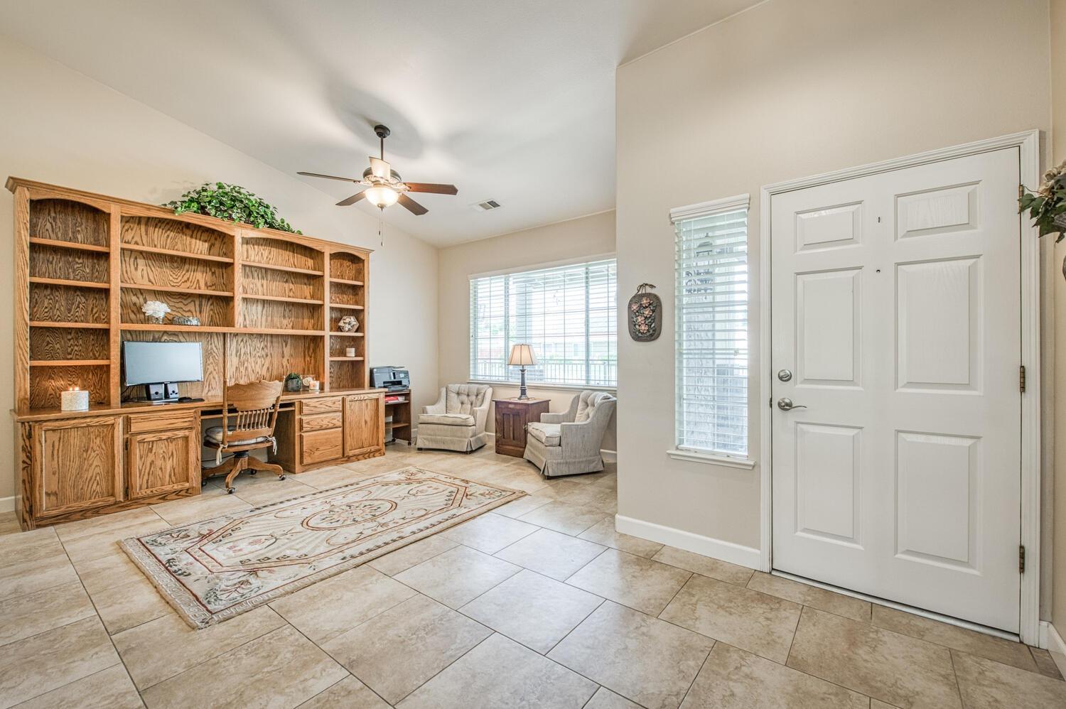 2512 Keats Avenue Clovis, CA 93611 - Photo 8 of 39 a living room with furniture a dining table and large window