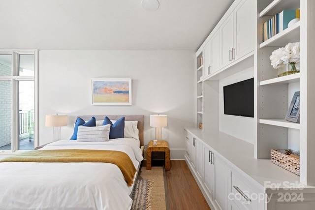 1500 Queens Road, Unit 301 Charlotte, NC 28207 - Photo 12 of 12 a spacious bedroom with a bed and a window