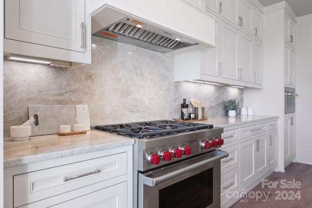1500 Queens Road, Unit 301 Charlotte, NC 28207 - Photo 4 of 12 a stove top oven sitting inside of a kitchen