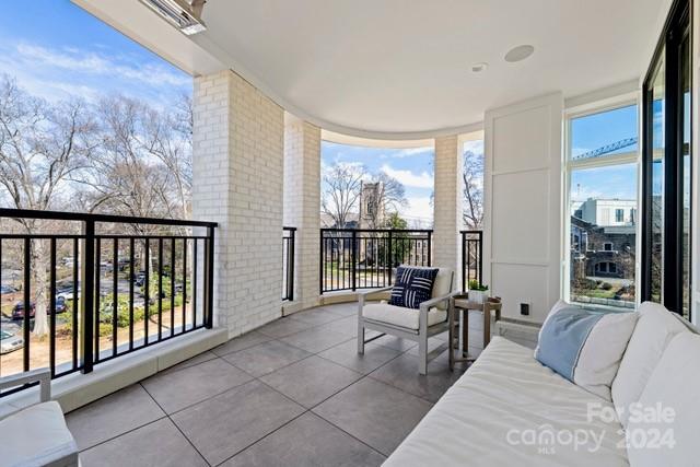 1500 Queens Road, Unit 301 Charlotte, NC 28207 - Photo 7 of 12 a lobby with furniture and large window