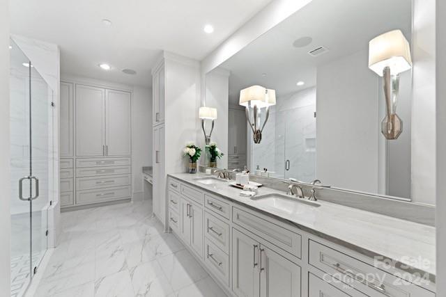 1500 Queens Road, Unit 301 Charlotte, NC 28207 - Photo 9 of 12 a bathroom with a double vanity sink mirror and shower