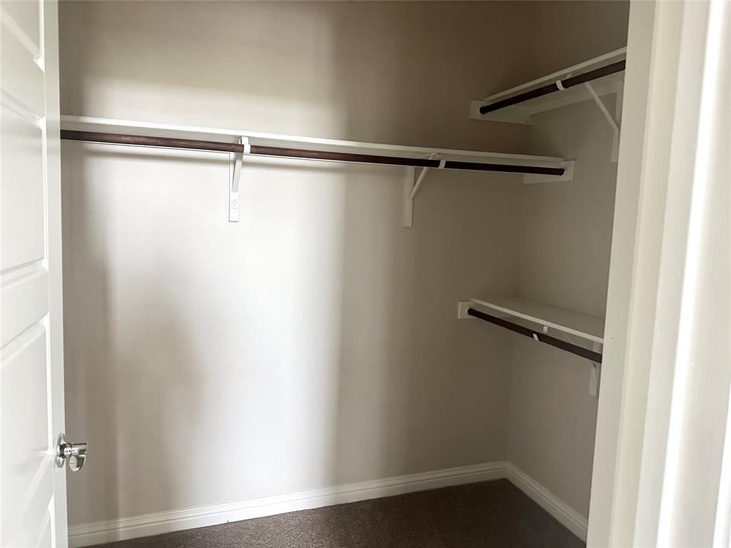 6814 East Riverside Drive, Unit 26 Austin, TX 78741 - Photo 13 of 21 Ample shelving and hanging space defines this well-organized closet.