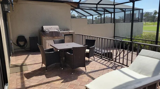 a view of a roof deck with furniture