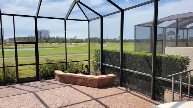 a bathroom with a bathtub and next to a window