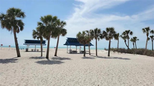 a view of outdoor space with beach and lake view