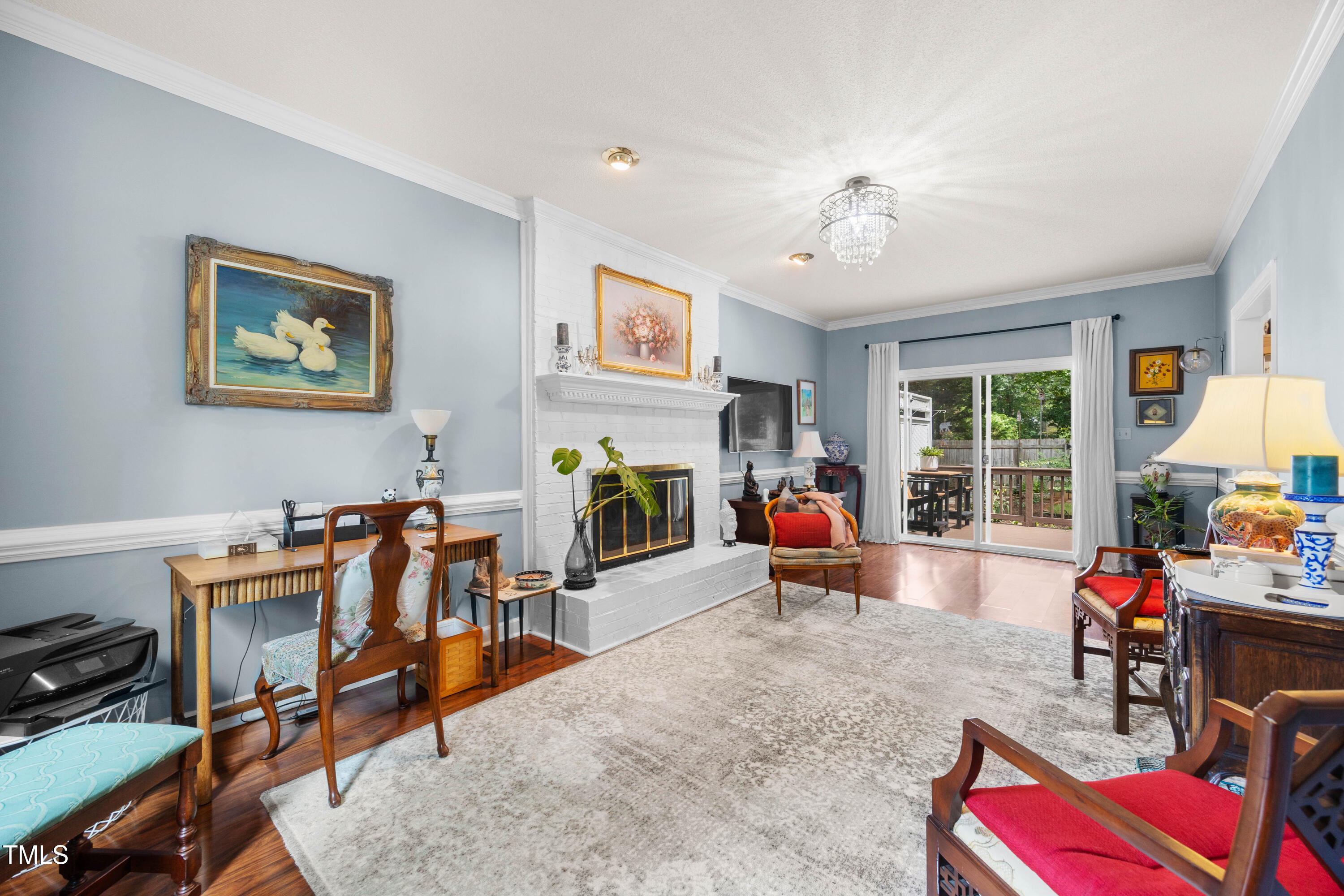 207 Wintermist Drive Cary, NC 27513 - Photo 12 of 43 a living room with furniture gym equipment and a window
