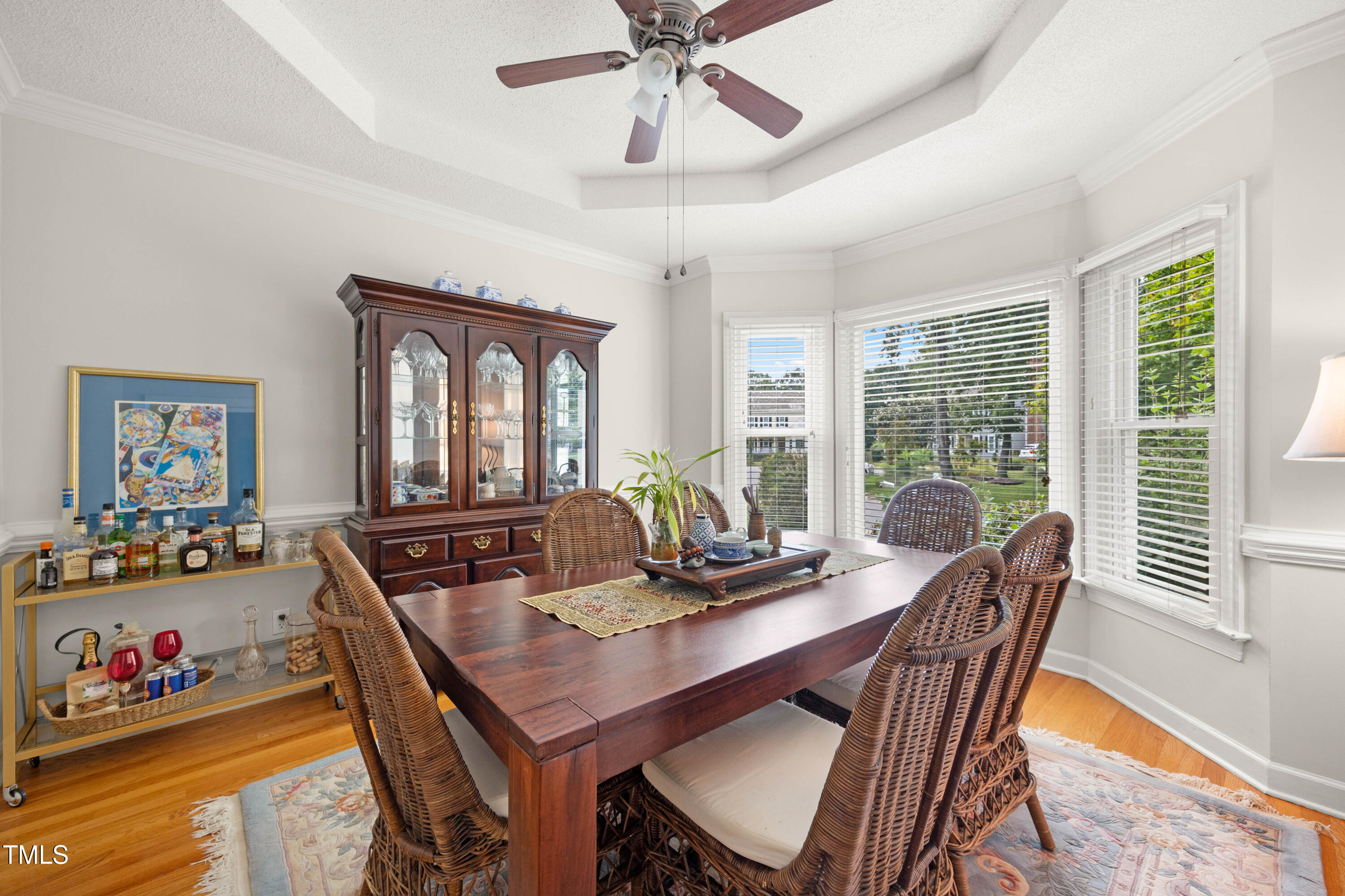 207 Wintermist Drive Cary, NC 27513 - Photo 16 of 43 a dining room with furniture a rug and a chandelier
