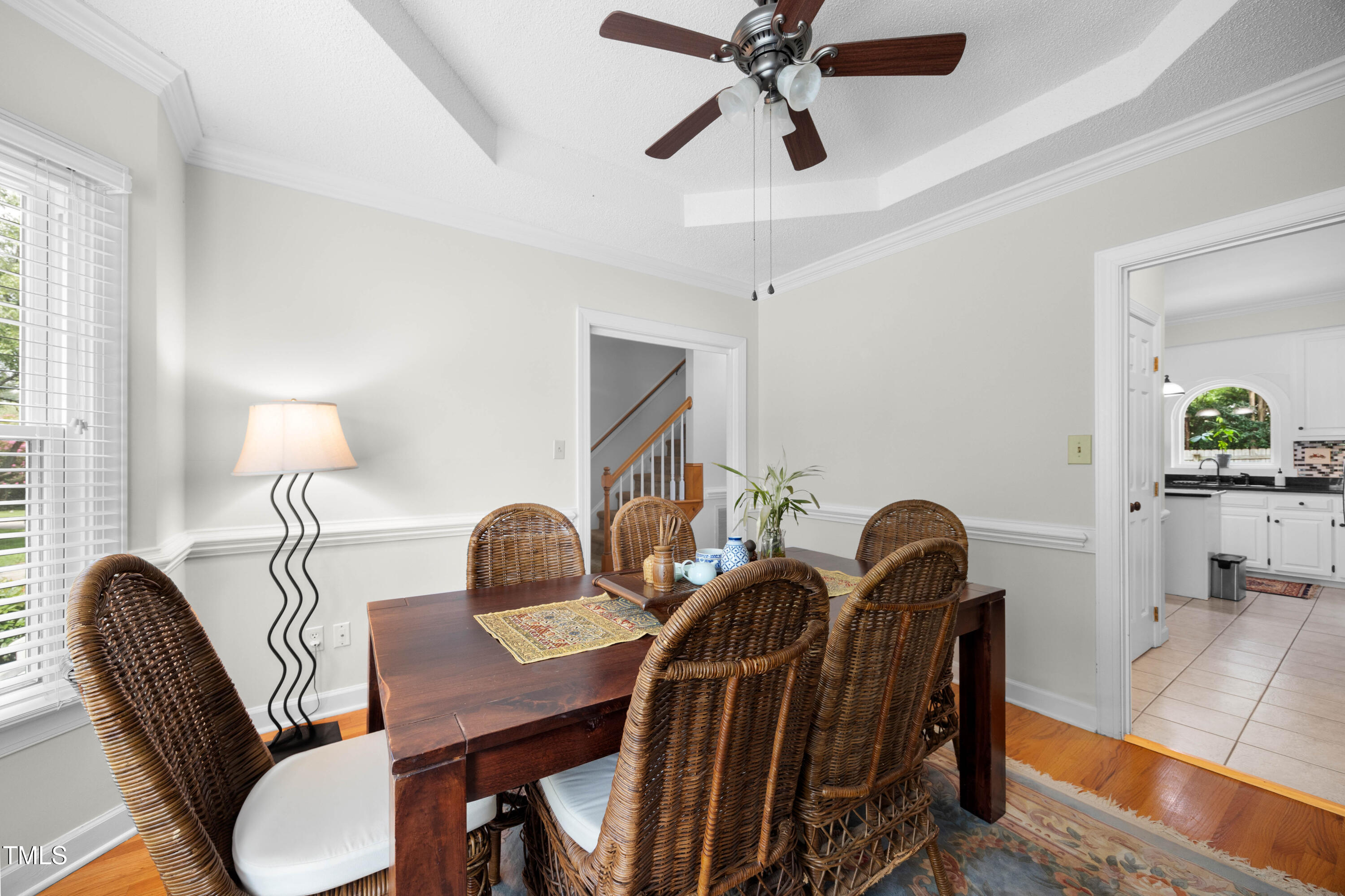 207 Wintermist Drive Cary, NC 27513 - Photo 17 of 43 a view of a dining room with furniture and wooden floor