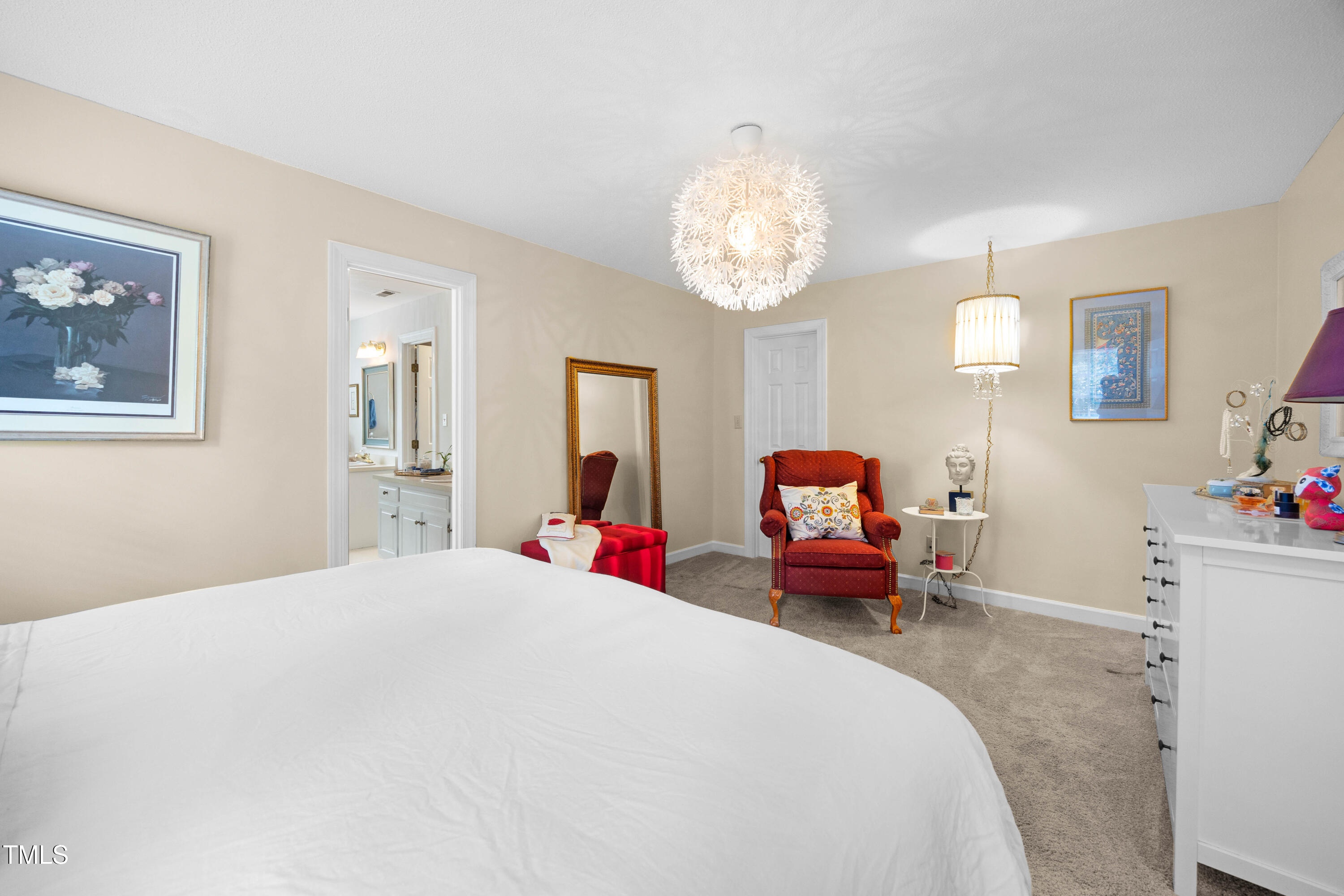 207 Wintermist Drive Cary, NC 27513 - Photo 21 of 43 a bedroom with a bed and a chandelier