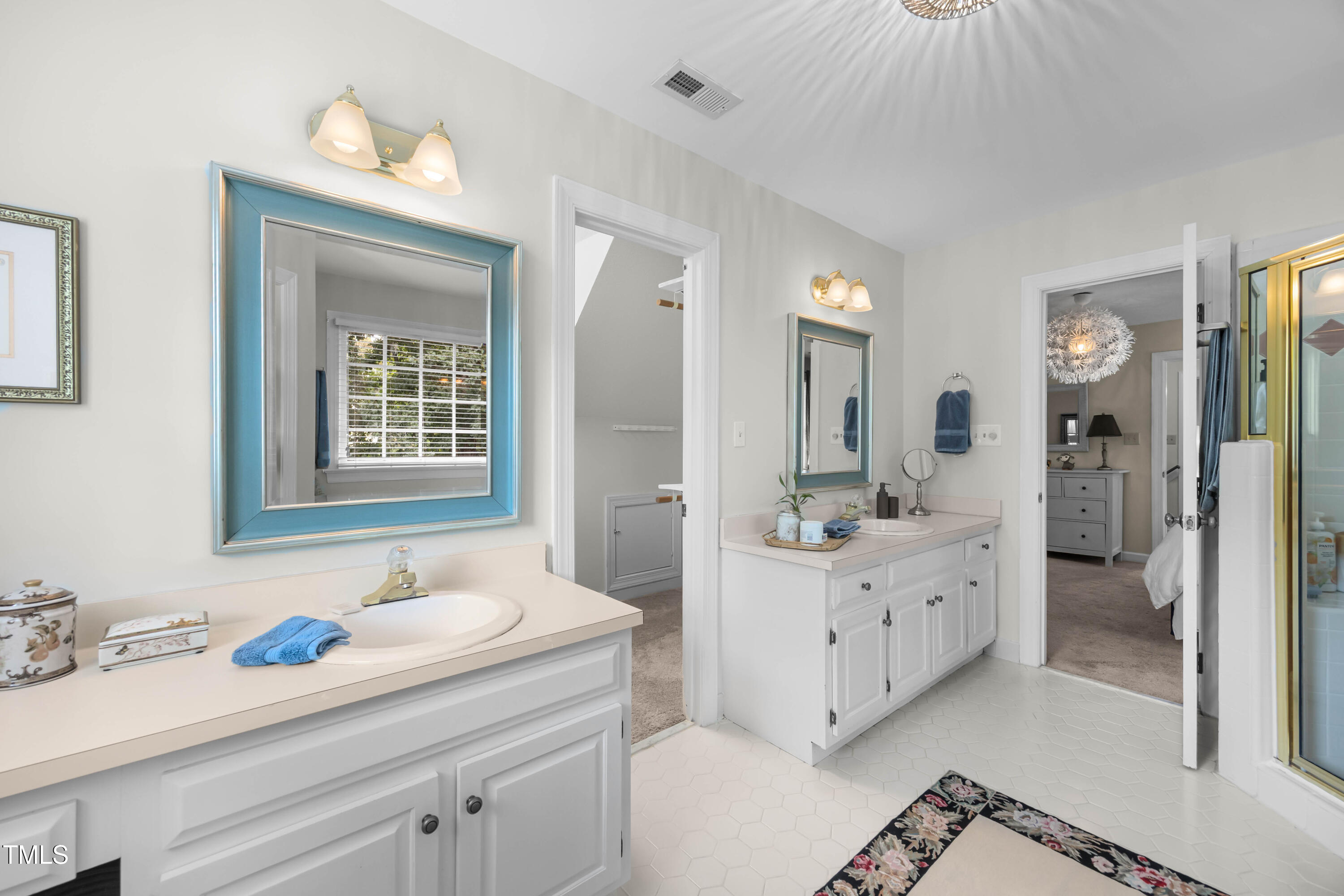 207 Wintermist Drive Cary, NC 27513 - Photo 23 of 43 a bathroom with a sink vanity granite tub and a mirror