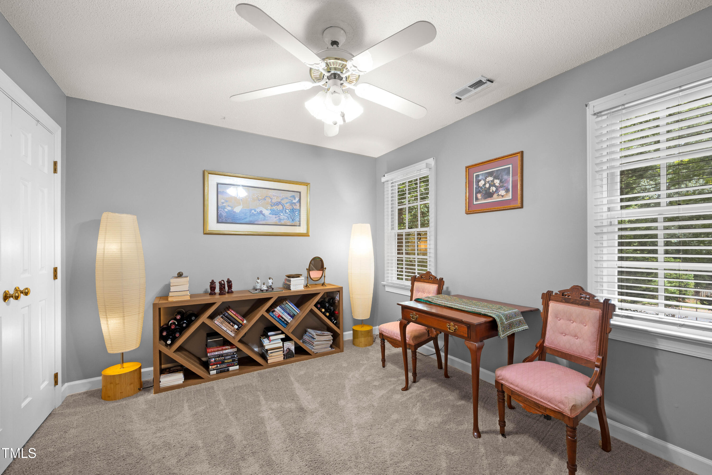 207 Wintermist Drive Cary, NC 27513 - Photo 28 of 43 a view of a livingroom with furniture and a ceiling fan