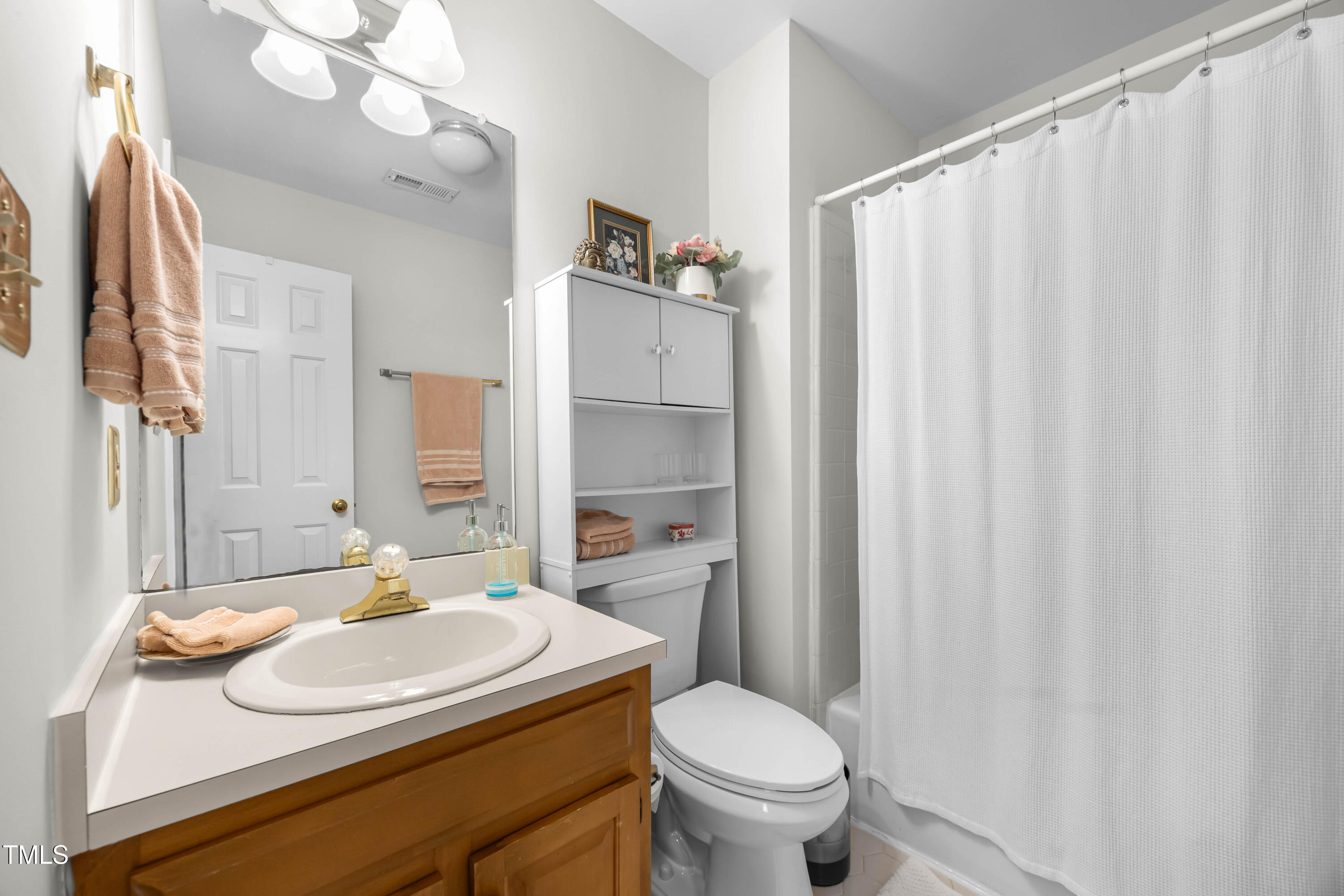 207 Wintermist Drive Cary, NC 27513 - Photo 30 of 43 a bathroom with a sink toilet and shower