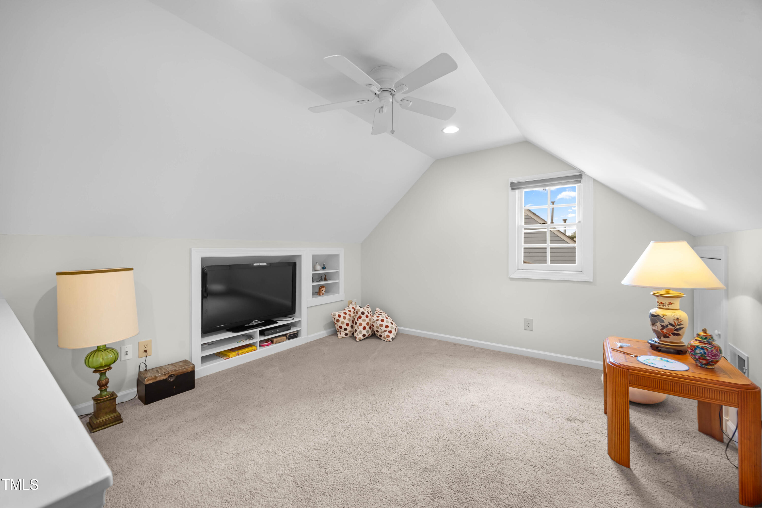 207 Wintermist Drive Cary, NC 27513 - Photo 31 of 43 a living room with furniture and a flat screen tv
