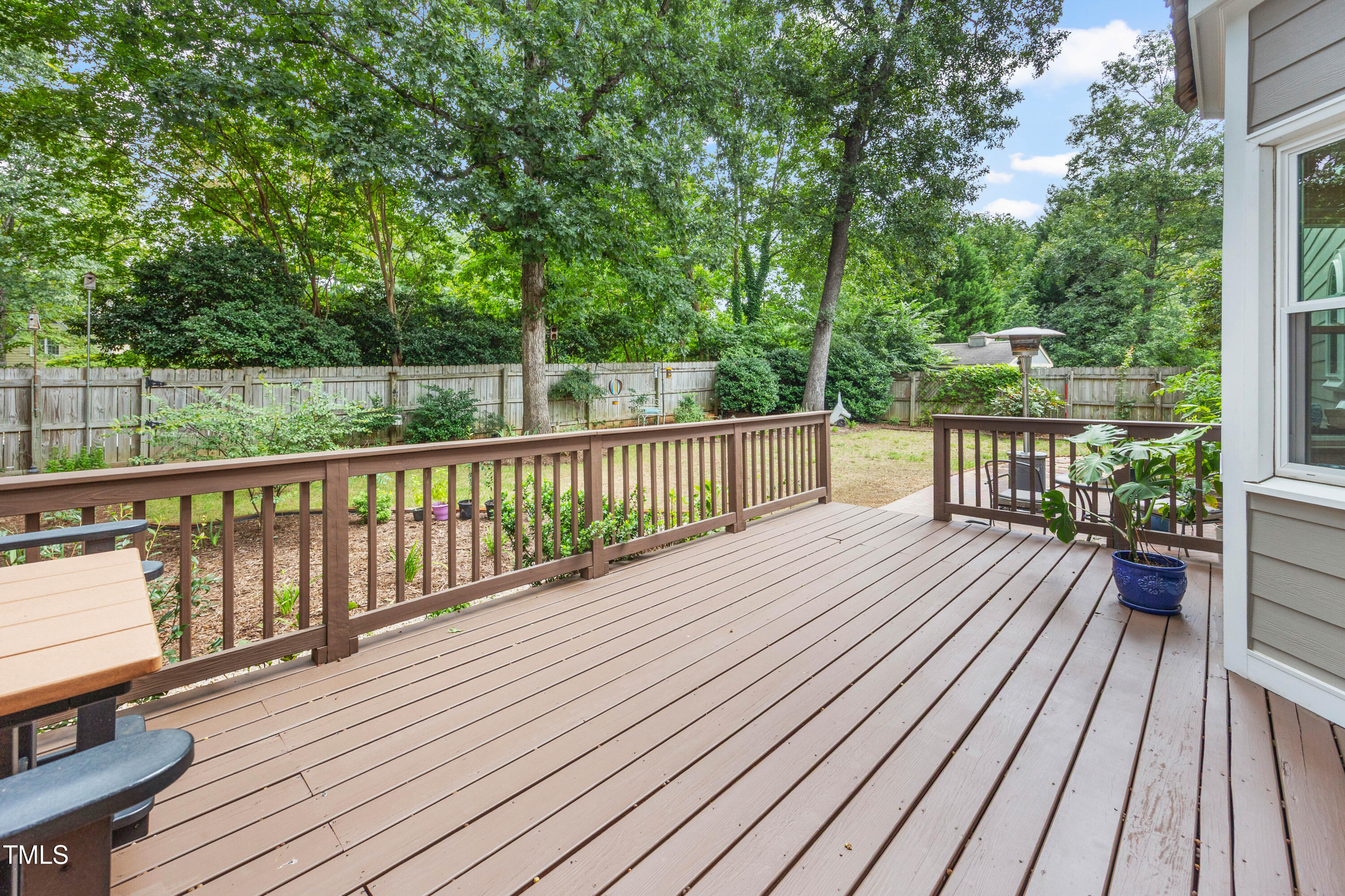 207 Wintermist Drive Cary, NC 27513 - Photo 34 of 43 a view of a wooden deck with a patio