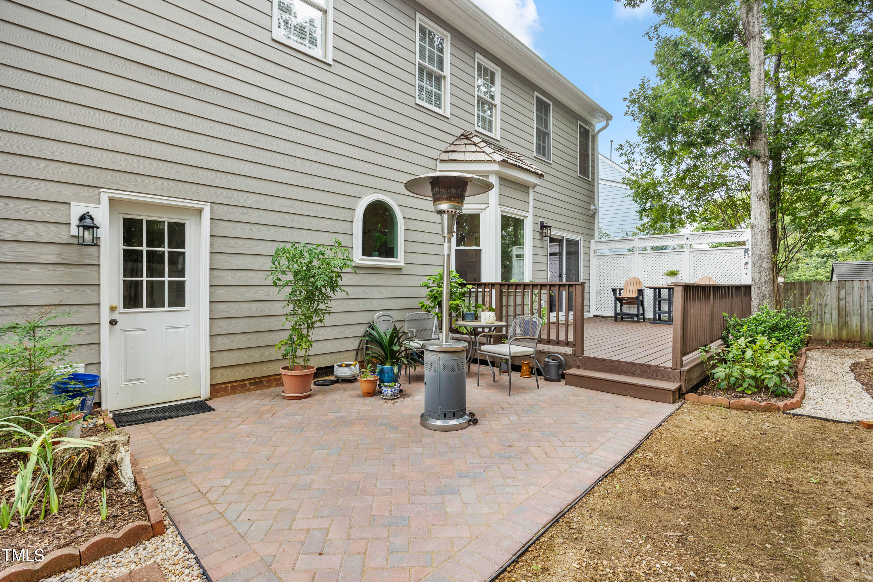 207 Wintermist Drive Cary, NC 27513 - Photo 35 of 43 a view of a patio with couches and potted plants
