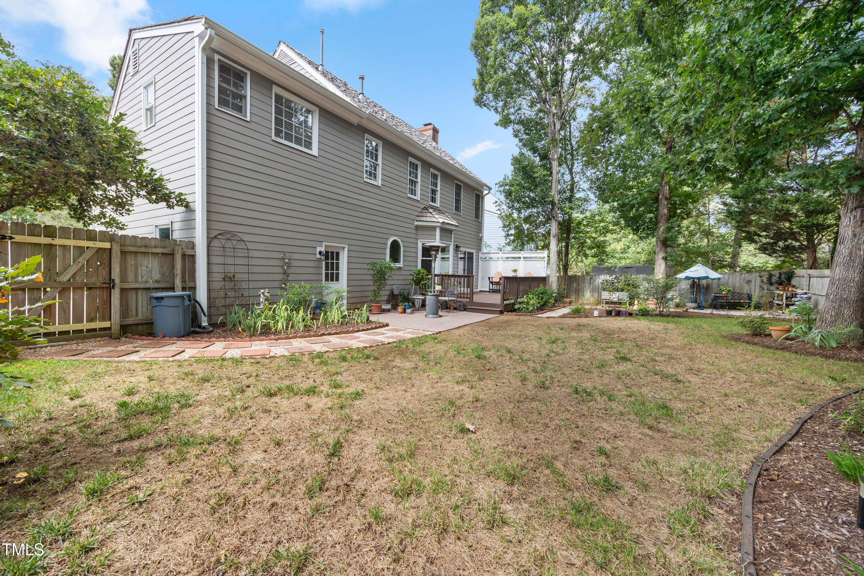 207 Wintermist Drive Cary, NC 27513 - Photo 37 of 43 a view of road with house and trees in the background